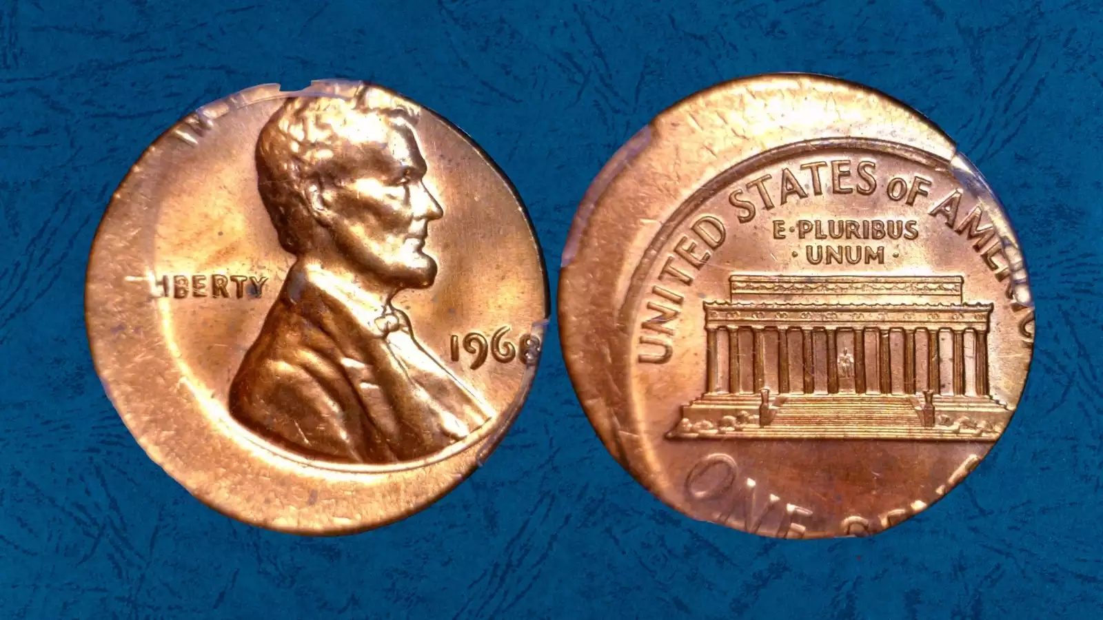 1968 Lincoln cent off-center strike with approximately 25% misalignment showing blank rim crescent and visible date